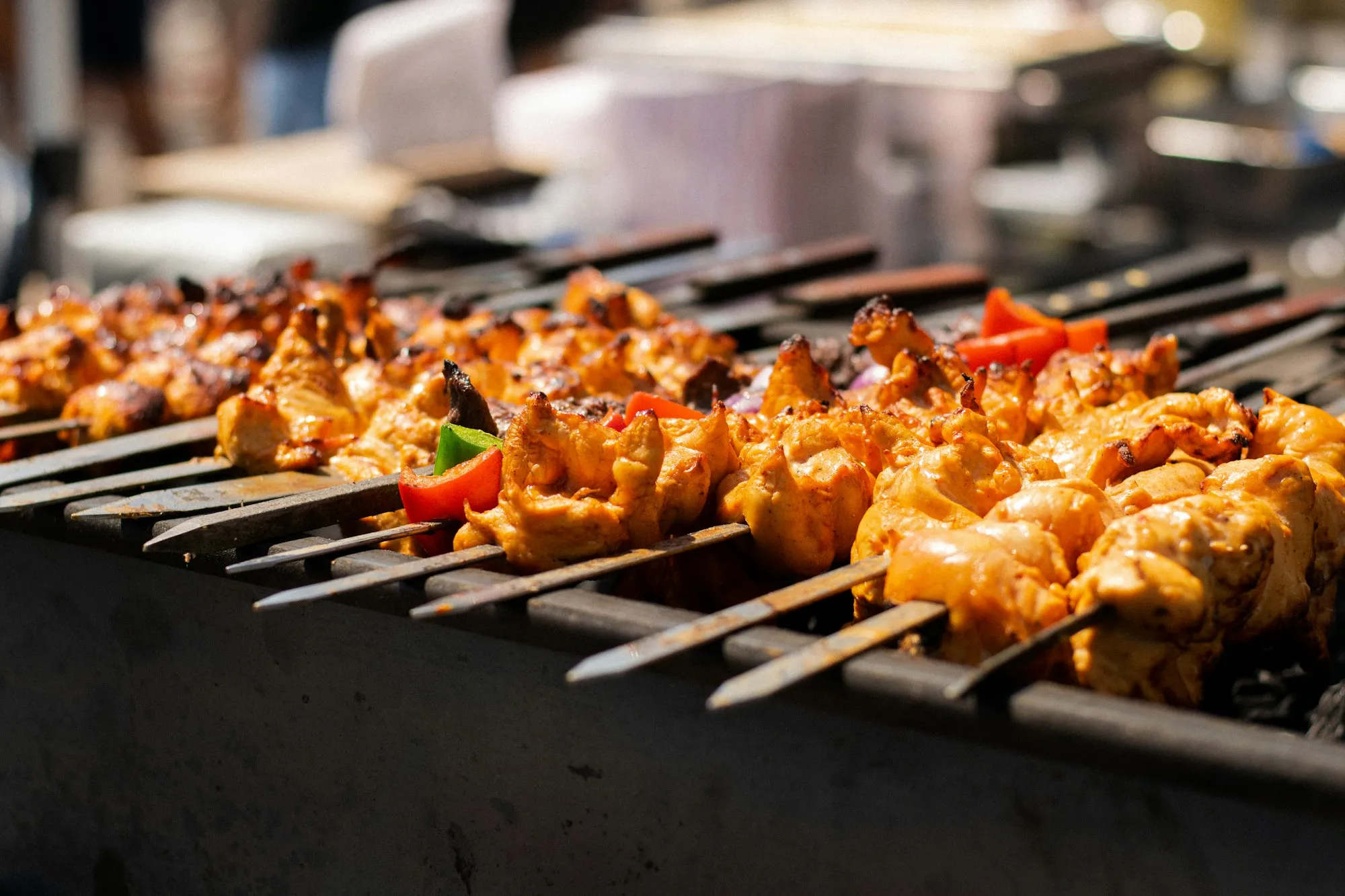 Kebab skewers over the tandoor